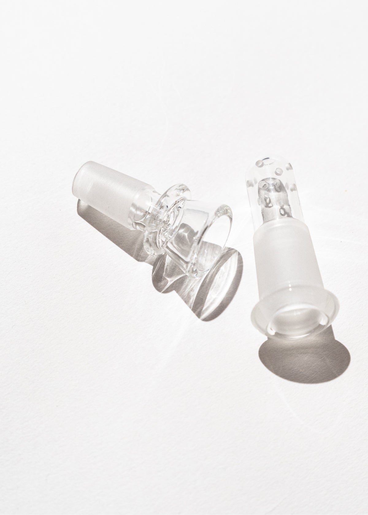 Clear glass bong bowl and downstem replacement set on white background